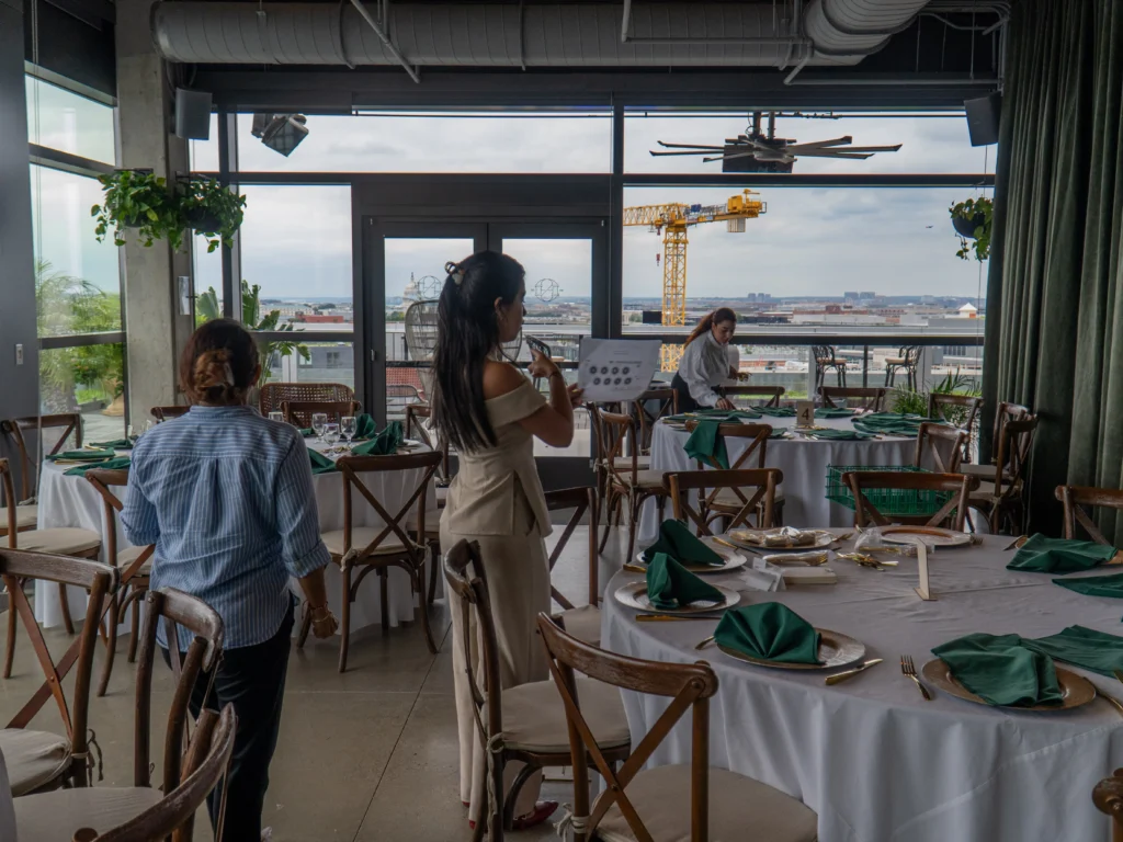 Catering: rooftop event space with round tables set for a wedding