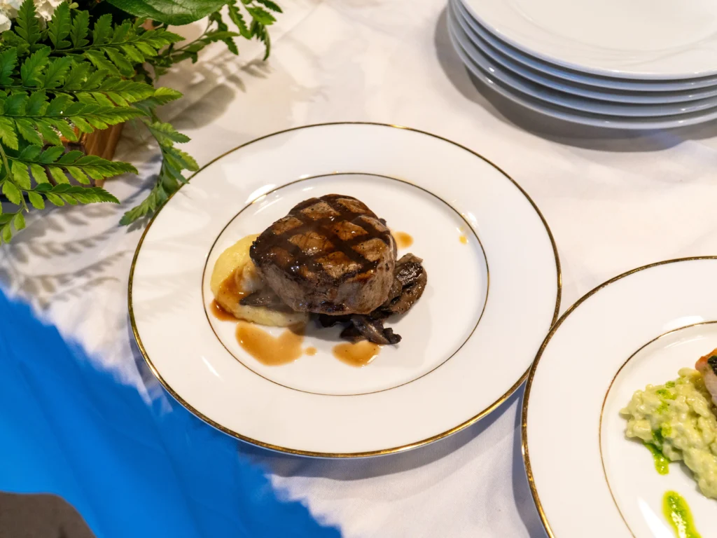 Catering: plated grilled steak with sauce at a catered event