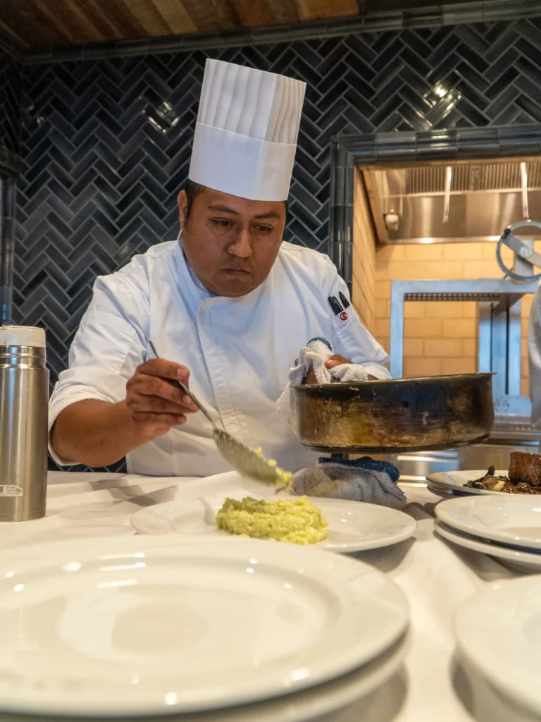Catering: chef plating a dish at a catered event
