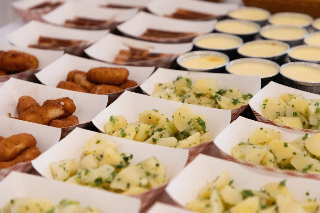 Catering: tapas trays with potato salad and croquettes at a buffet
