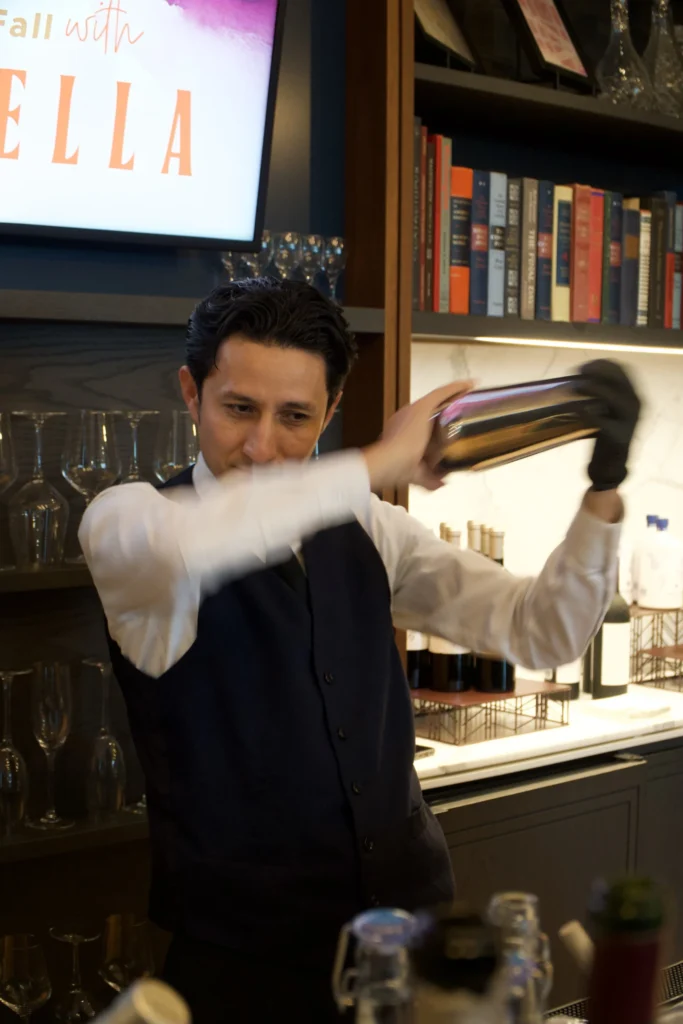 Catering: bartender shaking a cocktail at a catered event