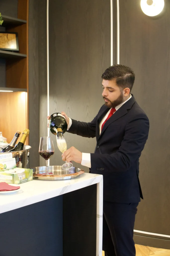 Catering: server pouring wine at a catered event