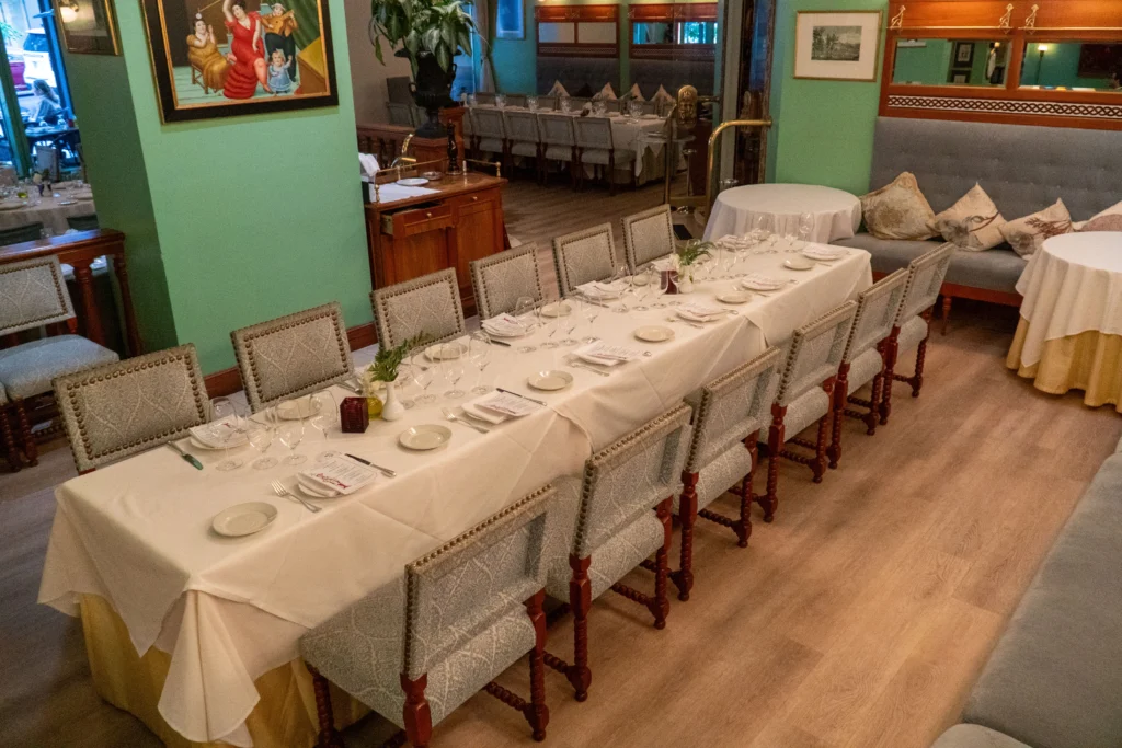 Partial Buyout: dining room with a long table set for a group event