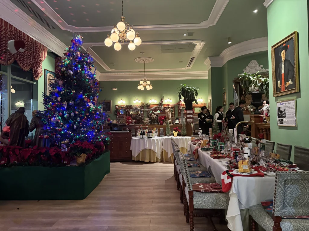 Partial Buyout: dining room decorated with a Christmas tree and tables set for a holiday event
